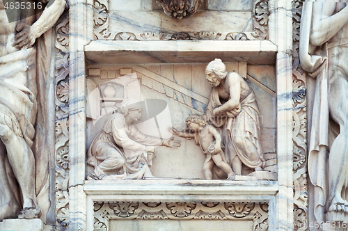 Image of Statue on the wall of Milan cathedral