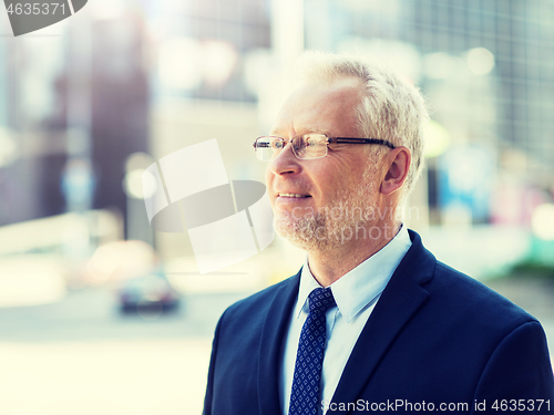 Image of senior businessman on city street