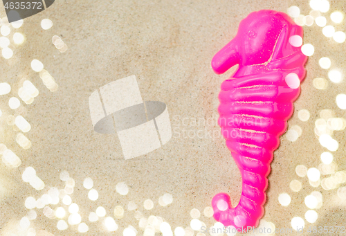 Image of close up of sea horse mold on summer beach sand