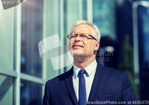 Image of senior businessman on city street