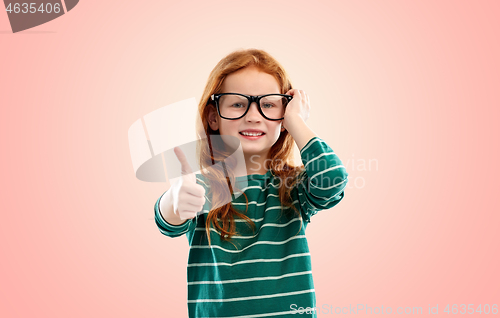 Image of smiling red haired student girl in glasses