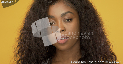 Image of Beautiful black lady biting lip