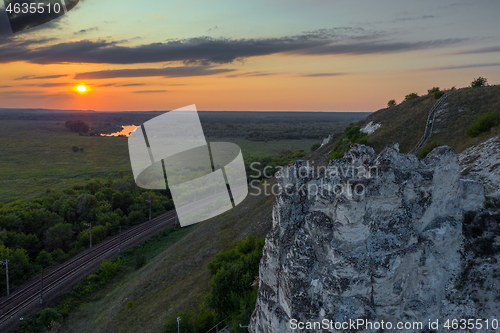 Image of Sunset above green valley in Divnogorye