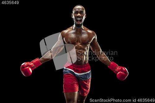 Image of Hand of boxer over black background. Strength, attack and motion concept