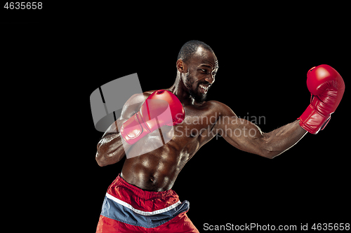 Image of Hand of boxer over black background. Strength, attack and motion concept