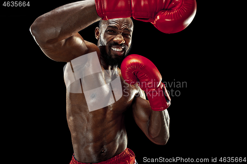 Image of Hand of boxer over black background. Strength, attack and motion concept