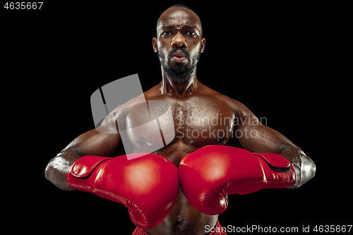 Image of Hand of boxer over black background. Strength, attack and motion concept