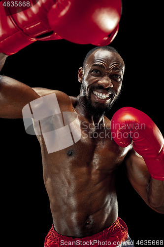 Image of Hand of boxer over black background. Strength, attack and motion concept