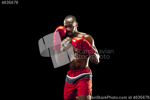 Image of Hand of boxer over black background. Strength, attack and motion concept