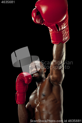 Image of Hand of boxer over black background. Strength, attack and motion concept