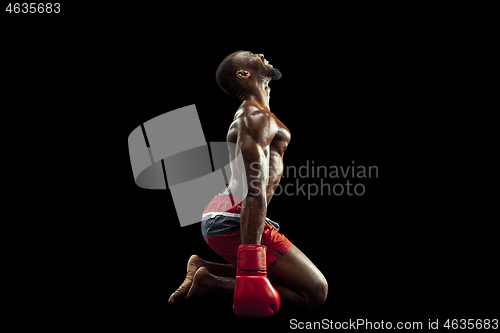 Image of Hand of boxer over black background. Strength, attack and motion concept