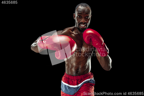 Image of Hand of boxer over black background. Strength, attack and motion concept