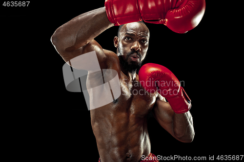 Image of Hand of boxer over black background. Strength, attack and motion concept