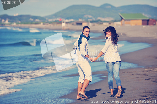 Image of happy young couple have fun at beautiful beach