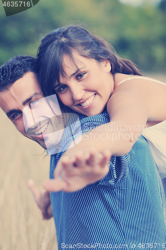 Image of happy young couple have romantic time outdoor