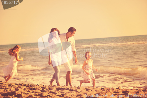 Image of happy young  family have fun on beach