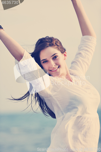 Image of young woman enjoy on beach