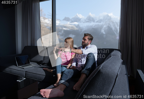 Image of Young couple watching television