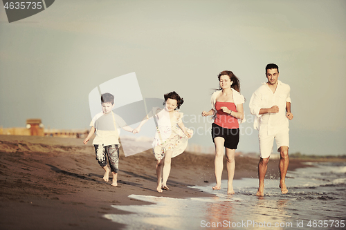 Image of happy young family have fun on beach