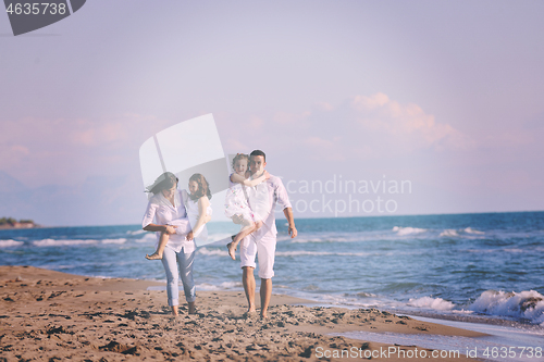 Image of happy young  family have fun on beach