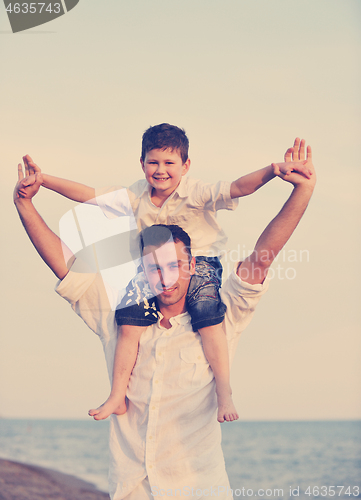 Image of happy young family have fun on beach