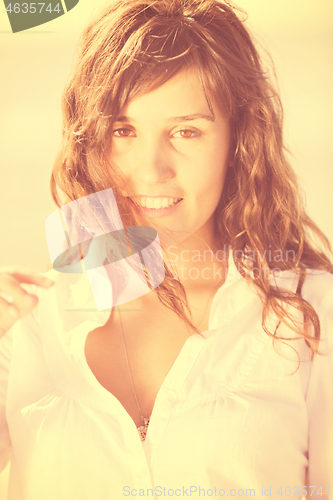Image of happy young woman on beach
