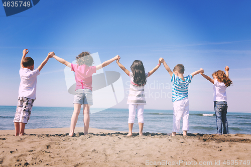 Image of happy young  people group have fun on beach