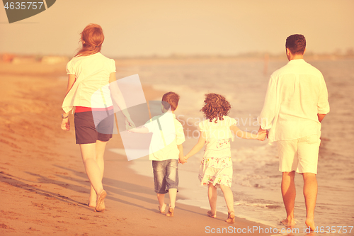 Image of happy young family have fun on beach