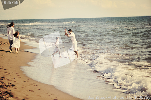 Image of happy young  family have fun on beach