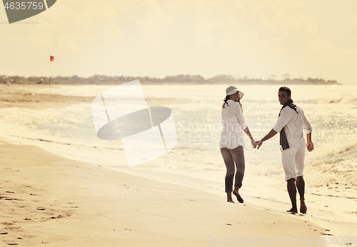 Image of happy young couple have fun at beautiful beach