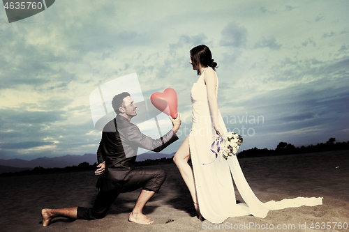 Image of romantic beach wedding at sunset