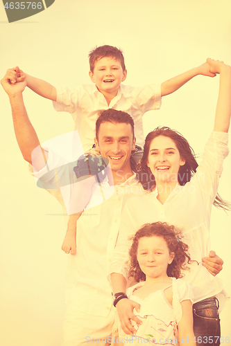 Image of happy young family have fun on beach