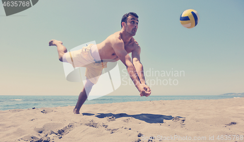 Image of male beach volleyball game player