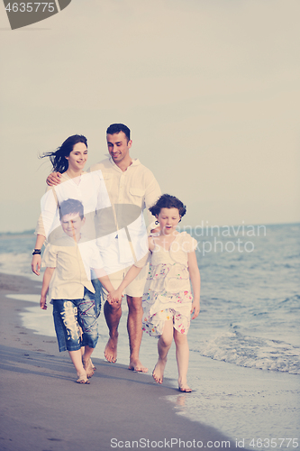 Image of happy young family have fun on beach