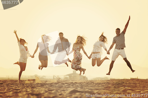 Image of happy young  people group have fun on beach