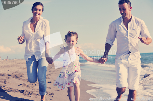 Image of happy young  family have fun on beach
