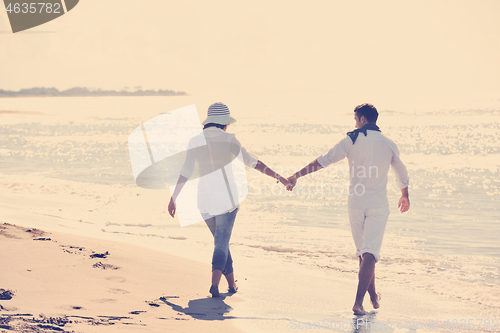 Image of happy young couple have fun at beautiful beach