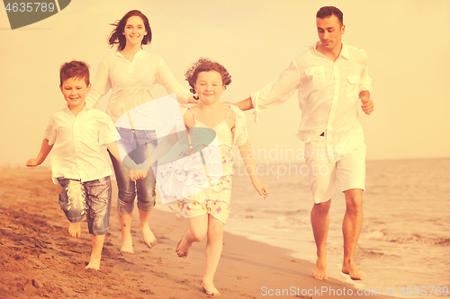 Image of happy young family have fun on beach