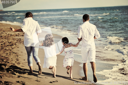 Image of happy young  family have fun on beach