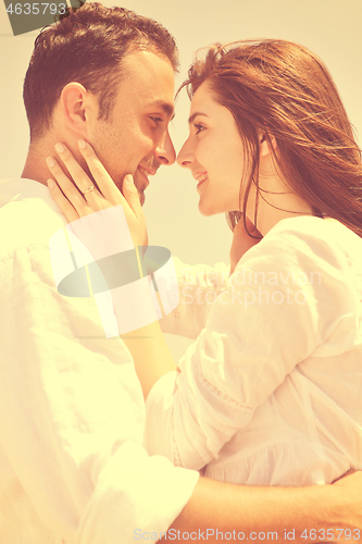 Image of happy young couple have fun on beach