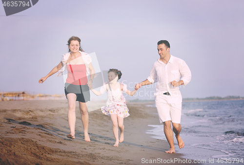 Image of happy young family have fun on beach