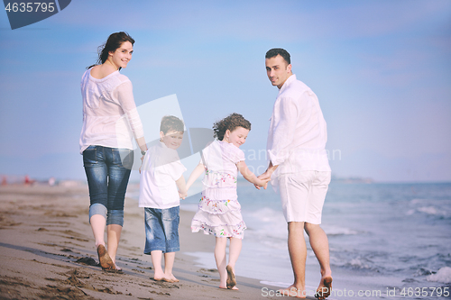 Image of happy young family have fun on beach