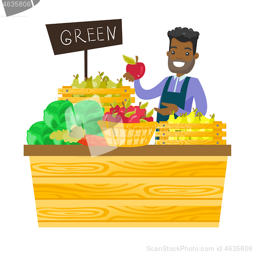Image of Young african-american worker of grocery store.