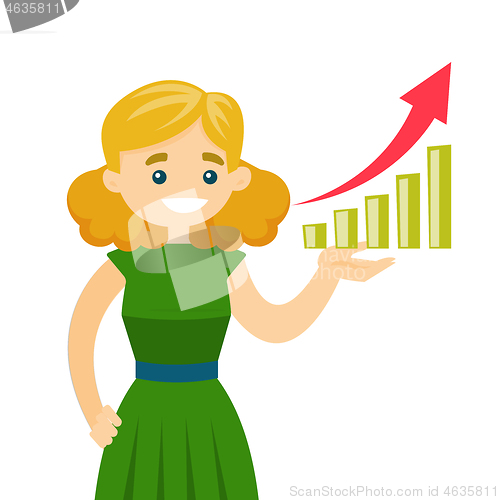 Image of Young business woman pointing at chart going up.