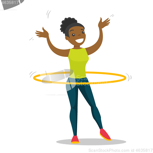 Image of Young african woman doing exercises with hula hoop