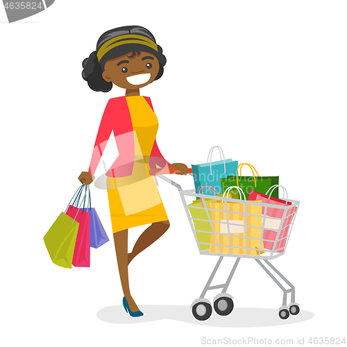 Image of Young african-american woman with shopping bags.