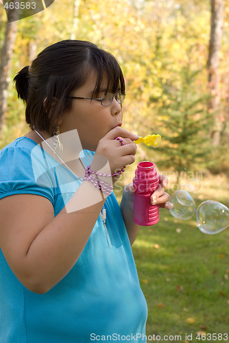 Image of Girl Blowing Bubbles