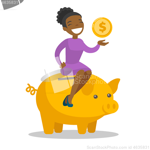 Image of African manager putting a coin in a piggy bank.