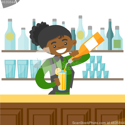 Image of Young african-american bartender making a cocktail