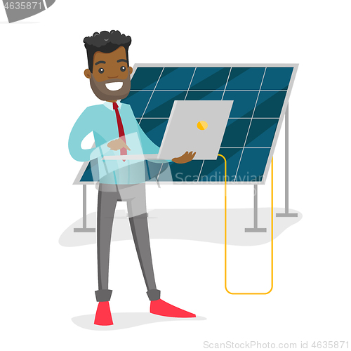 Image of Engineer of solar power plant working on a laptop.